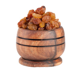raisins in a wooden bowl isolated on white background