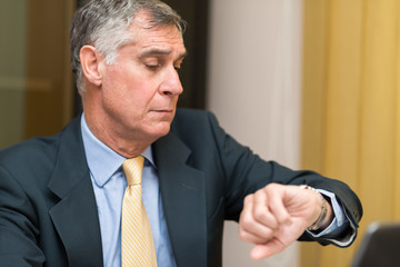 Businessman taking a look at his watch