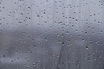 Drops on the window glass sweaty.