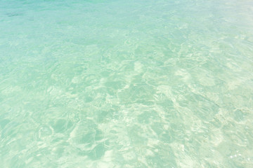 Fototapeta na wymiar Ocean water background, clean and clear blue emerald sea beach.