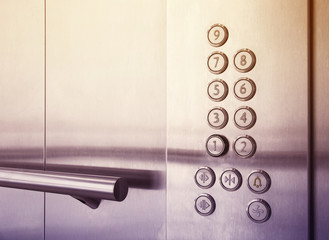 Buttons and handrail in  modern elevator business centers © Azat Valeev