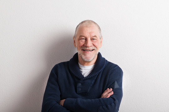 Senior Man In Blue Woolen Sweater, Studio Shot.