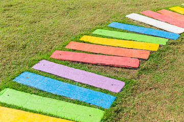 colorful rainbow foot path garden decoration funny park background.
