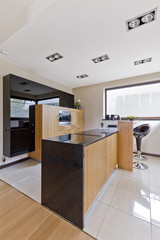 Open kitchen with elegant wooden furniture