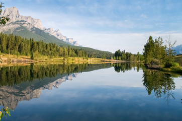 Fototapeta na wymiar Canmore Alberta, Quarry Lake, Reflection of Mount Rundle.