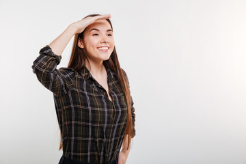 Naklejka premium Smiling Woman in shirt looking away