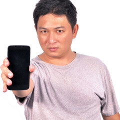 Middle Asian man 42 years showing smart phone to camera, human behavior concept.