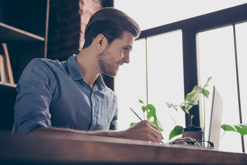 Portrait of young smart happy student preparing for the exams