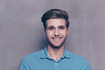 A portrait of handsome man in blue shirt looking at camera