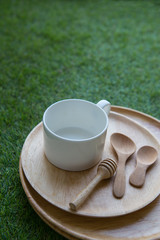 wood dish set on grass background