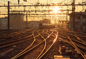 Plakat A train on the railroad tracks at Perrache station in Lyon (Gare de Lyon-Perrache), France, during sunrise.