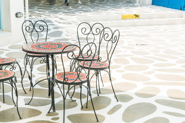 Outdoor patio with empty chair and table