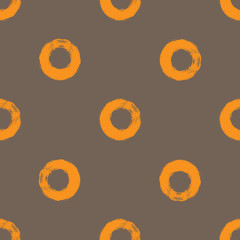 Repeated circles drawn a rough brush. Simple seamless pattern.