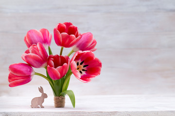 Pink tulips, spring flowers and Easter decoration.