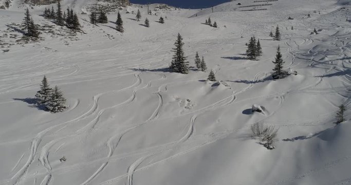 Tracks in the snow of snowboarders. Aerial view of the ski slopes
