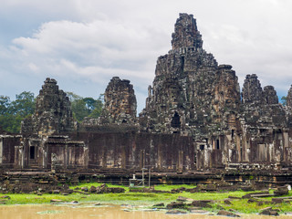Fototapeta na wymiar Ancient Bayon Temple in Angkor Thom city complex, the 12th century city of Khmer Empire