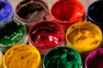 different colour paint in bottles closeup