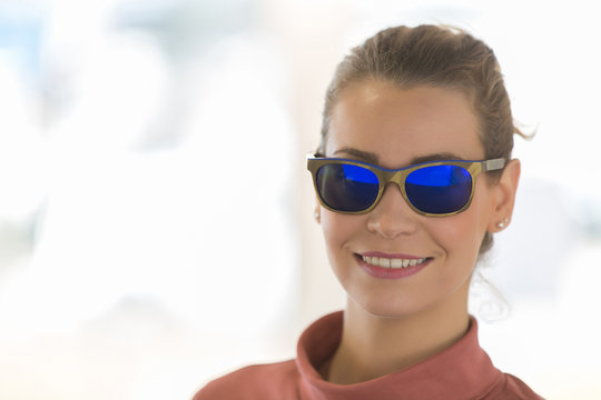 woman wearing sunglasses in optician shop