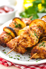 Grilled shish kebab or shashlik on skewers closeup on white background