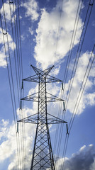 Fototapeta premium Sky high voltage pylon clouds.