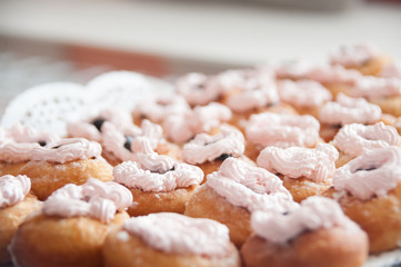sweet donuts with cream, closeup