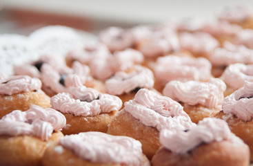 sweet donuts with cream, closeup