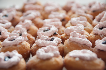 sweet donuts with cream, closeup