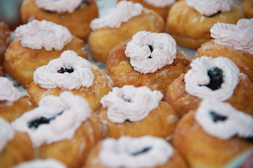 sweet donuts with cream, closeup