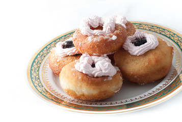 sweet donuts with cream on a plate