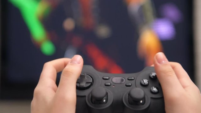 Young woman playing videogames.