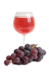 Bottle glass of wine and grapes on white background