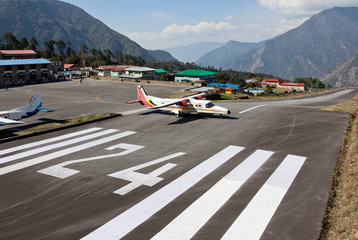 The aircraft on the runway of the airport Lukla - Nepal