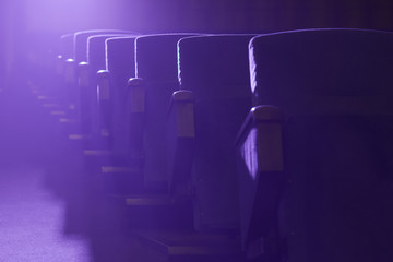 Empty movie theater with projection light falling into the lens