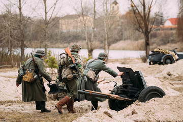 Re-enactors Dressed As German Wehrmacht Soldiers In WWII Roll Out