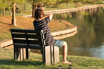 man stress sit on chair in the park
