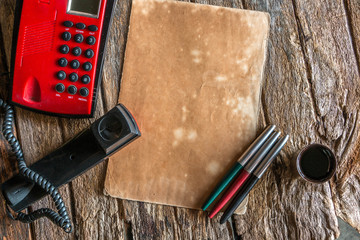red telephone on wood background old style