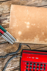 red telephone on wood background old style