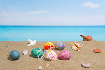 Fototapeta na wymiar Easter on beach background. Eggs on the sandy