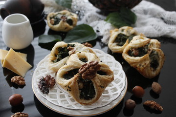 Spinach puffs with addition of cheese, walnuts and sesame seeds.Rustic style.
