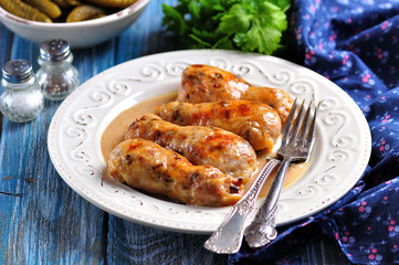 Baked chicken drumsticks stuffed with fried mushrooms and cheese in a creamy sauce.