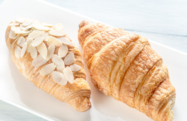 Croissants on the white plate: top view