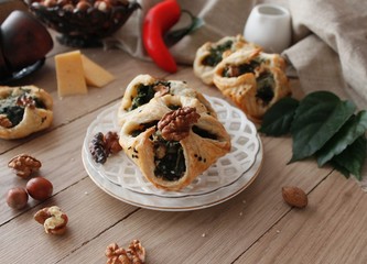 Spinach puffs with addition of cheese, walnuts and sesame seeds.Rustic style.