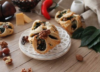 Spinach puffs with addition of cheese, walnuts and sesame seeds.Rustic style.