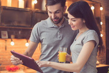 Young couple cooking in kitchen