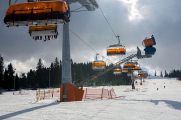 Chair lift in sunny day