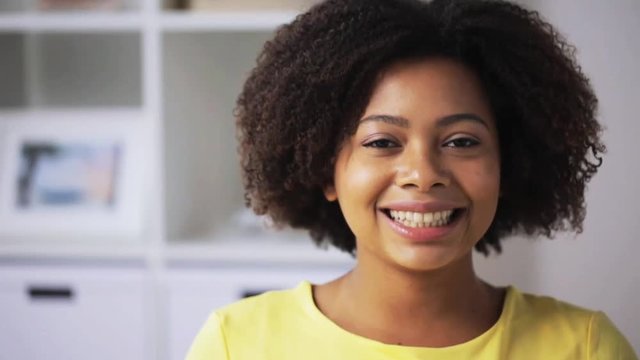 happy african american young woman face at home