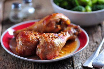 Baked chicken drumsticks with soy sauce, honey and grain mustard with boiled broccoli.