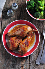 Baked chicken drumsticks with soy sauce, honey and grain mustard with boiled broccoli.