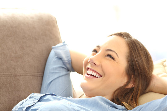 Woman relaxed lying on a couch