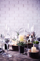Table served with succulents for dinner in living room